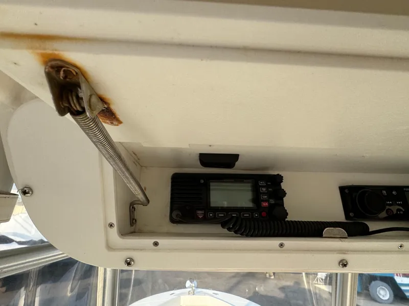 Slide: The Image of Interior view of a 2015 Ocean Runner 2900 boat's radio equipment compartment. - 9