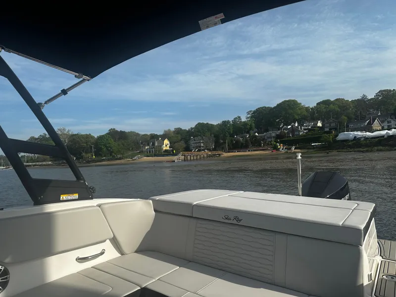 Slide: The Image of 2024 Sea Ray 230SPX boat interior with scenic waterfront view. - 5