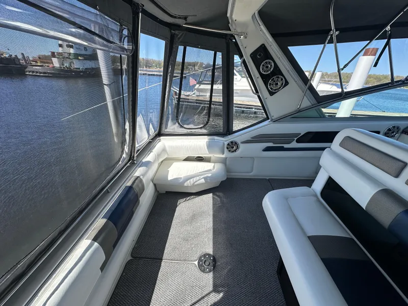 Slide: The Image of Interior of 1990 Sea Ray 310 Sundancer boat with seating and windows. - 20