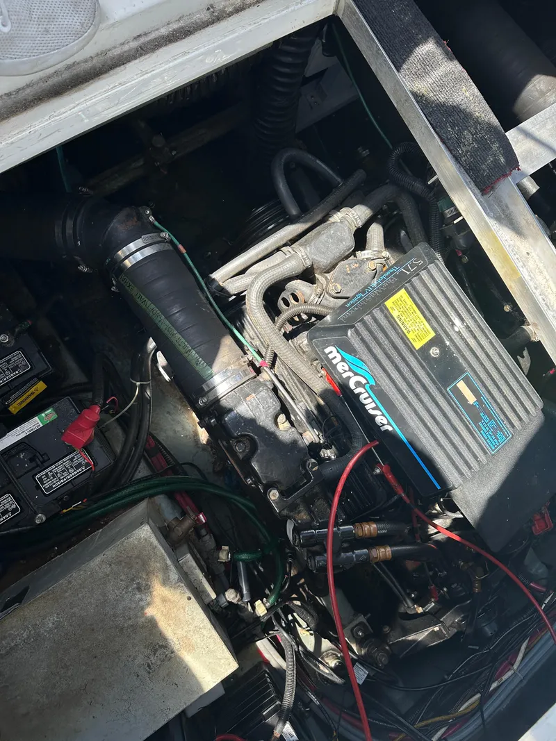 Slide: The Image of Engine compartment of a 1990 Sea Ray 310 Sundancer with MerCruiser components. - 28