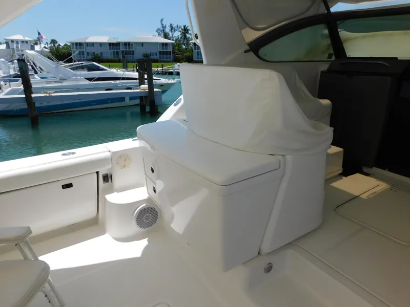Slide: The Image of 2001 Tiara Yachts 3800 Open interior with seating, docked at marina. - 14