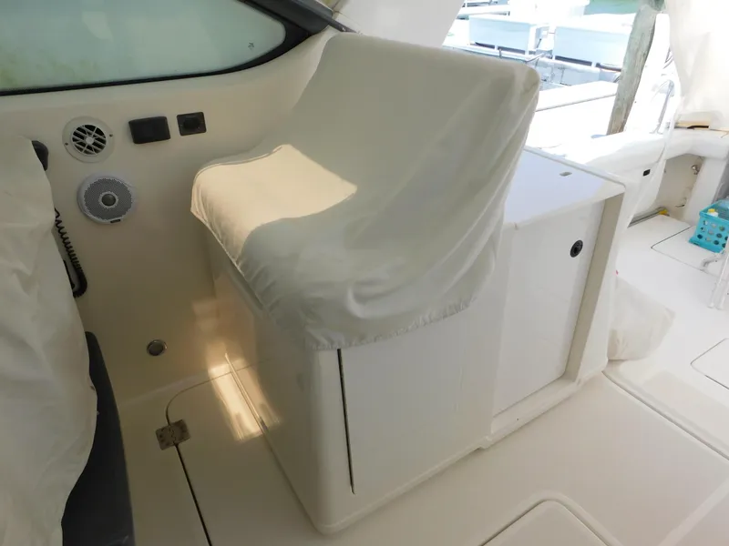 Slide: The Image of Captain's seat on a 2001 Tiara Yachts 3800 Open, covered and well-maintained. - 16