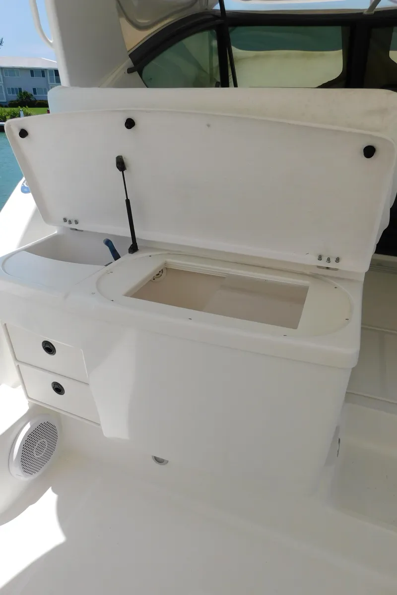 Slide: The Image of 2001 Tiara Yachts 3800 Open boat interior with storage compartment open. - 20