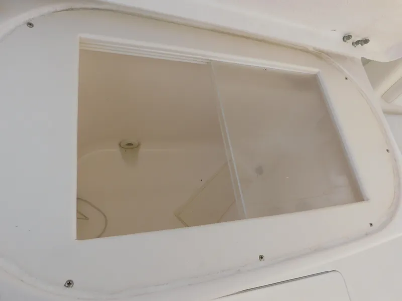 Slide: The Image of Hatch window on 2001 Tiara Yachts 3800 Open boat, showcasing interior view. - 22