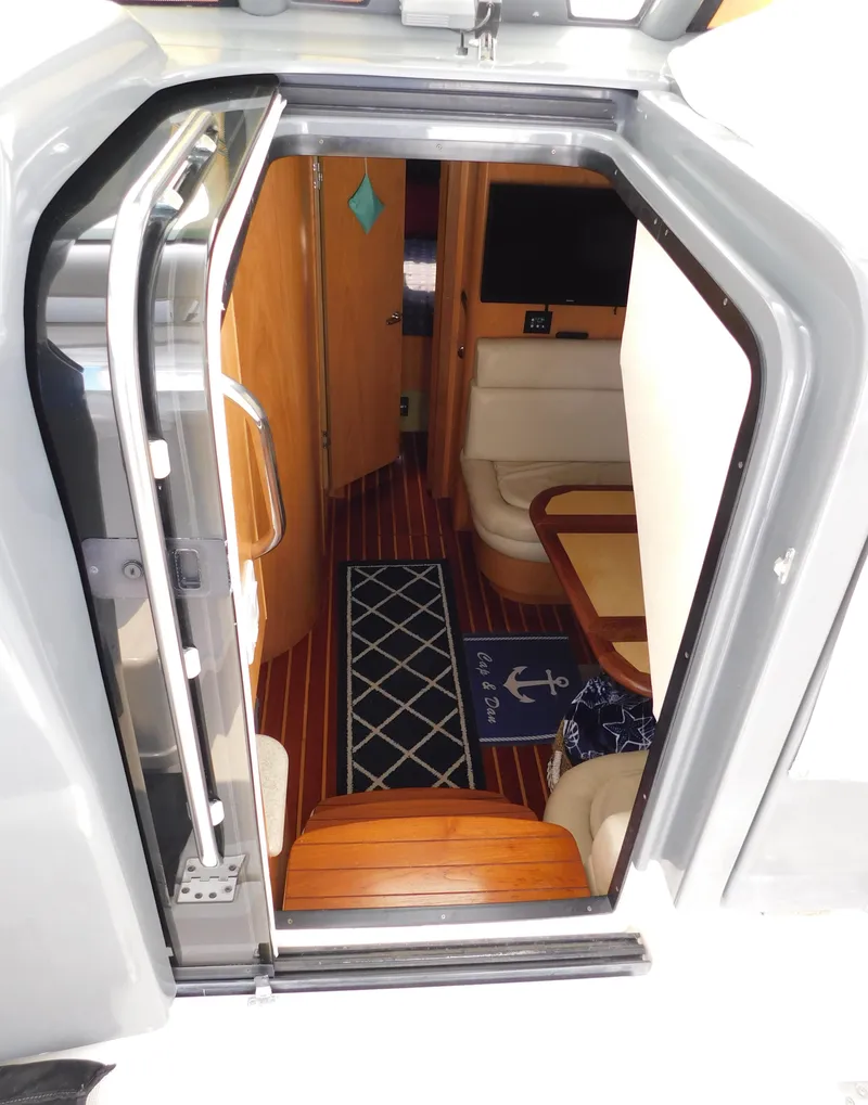 Slide: The Image of Interior view of 2001 Tiara Yachts 3800 Open, featuring wood flooring and seating area. - 29