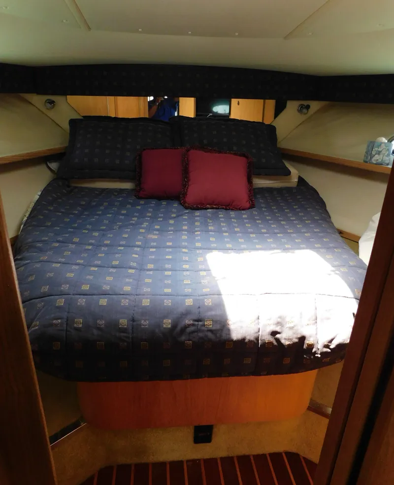 Slide: The Image of 2001 Tiara Yachts 3800 Open cabin interior with bed and pillows. - 41
