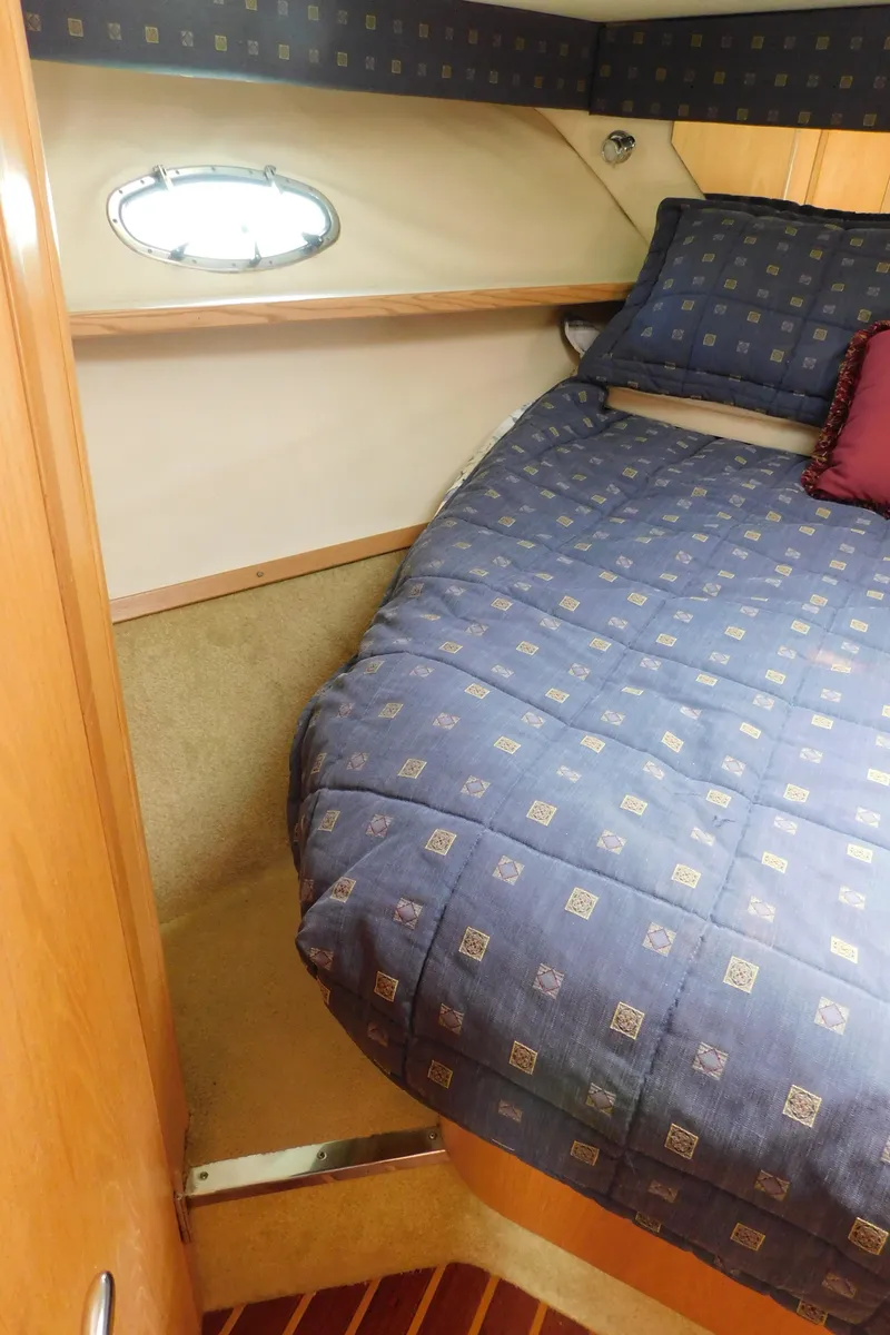 Slide: The Image of 2001 Tiara Yachts 3800 Open cabin with cozy bed and porthole window. - 43