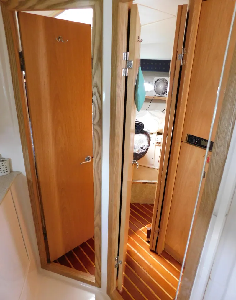 Slide: The Image of Interior view of 2001 Tiara Yachts 3800 Open, featuring wooden doors and flooring. - 48