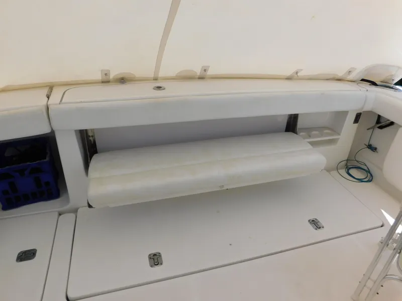 Slide: The Image of 2001 Tiara Yachts 3800 Open interior with foldable bench seat and storage compartments. - 8