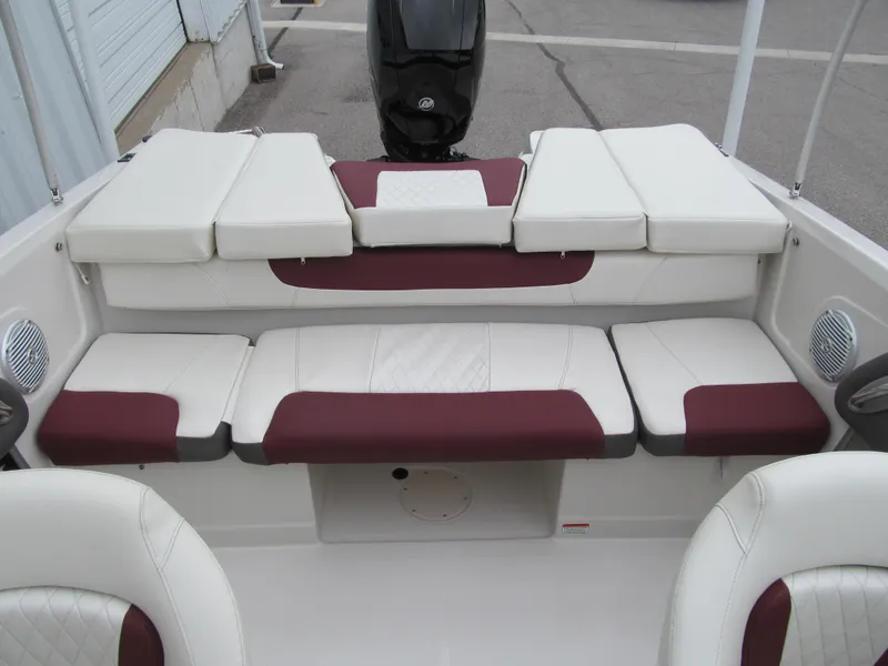 Slide: The Image of 2016 Tahoe 550 TF boat interior with white and maroon seating. - 10