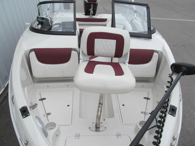 Slide: The Image of 2016 Tahoe 550 TF boat interior with red and white seating. - 13