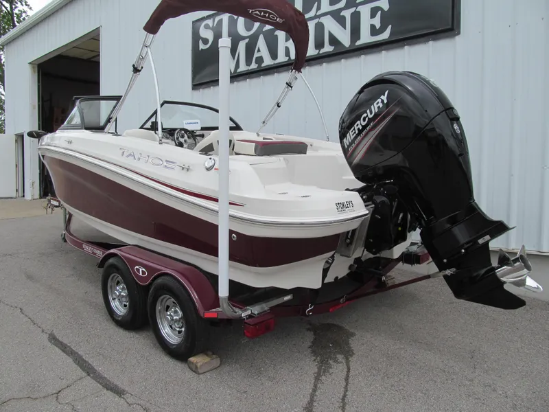 Slide: The Image of 2016 Tahoe 550 TF boat with Mercury engine on trailer at marine dealership. - 2