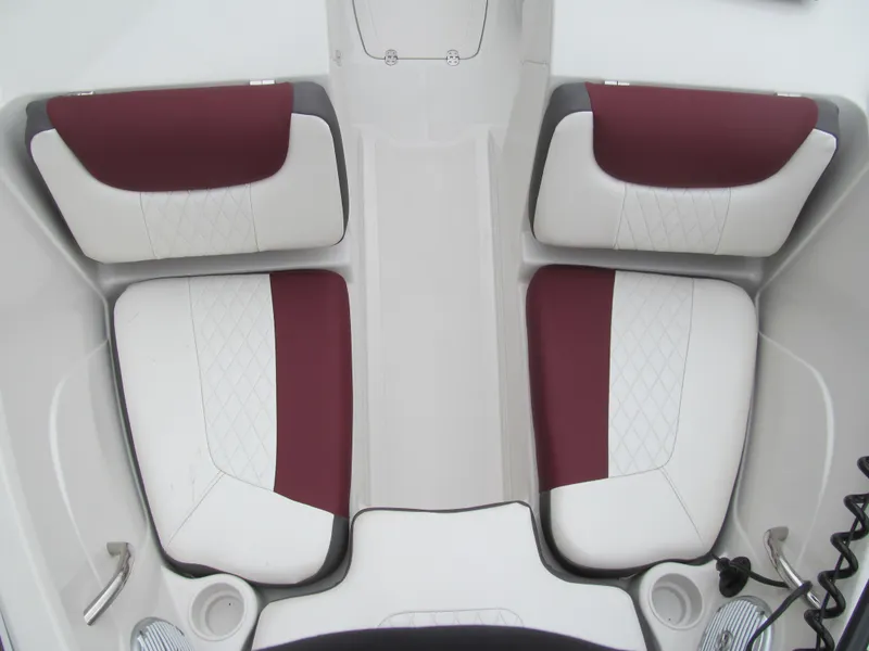 Slide: The Image of 2016 Tahoe 550 TF boat interior with maroon and white seating. - 8