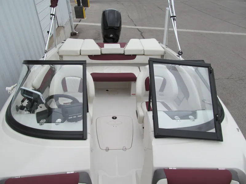 Slide: The Image of 2016 Tahoe 550 TF boat interior with dual windshields and seating. - 9