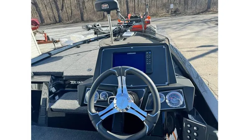 Slide: The Image of 2024 Ranger Z518 Cup-Equipped boat dashboard with steering wheel and navigation display. - 5