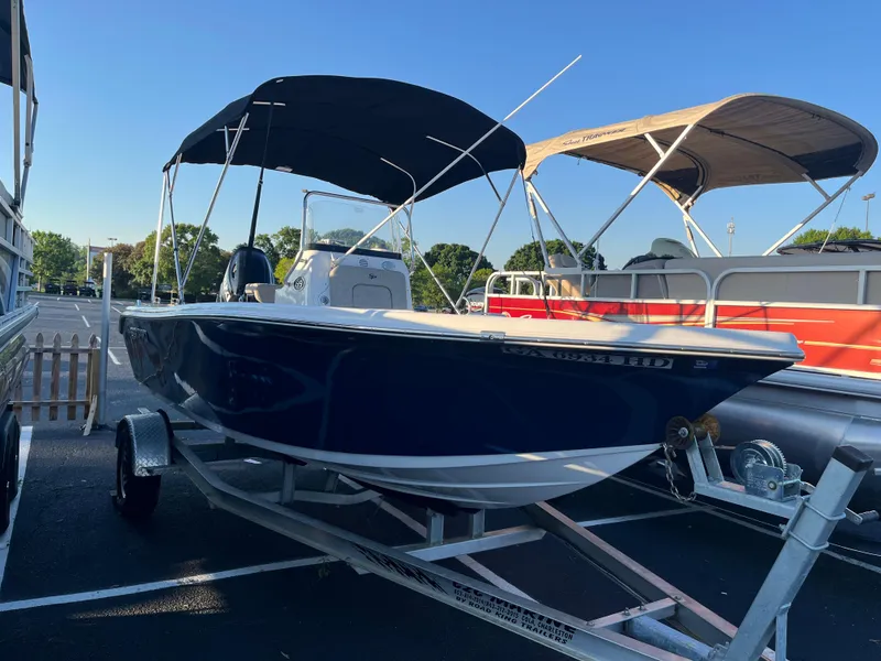 Slide: The Image of 2022 Sea Pro 199 Center Console boat on trailer, parked outdoors. - 0