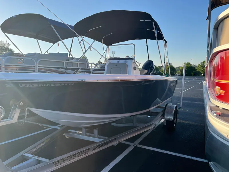 Slide: The Image of 2022 Sea Pro 199 Center Console boat on trailer in parking lot. - 1