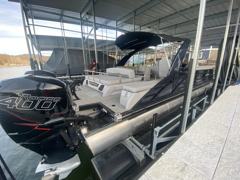 Slide: The Image of 2020 Bennington 30 QSBAX2 pontoon boat with Mercury Racing 400 engine docked under cover. - 17