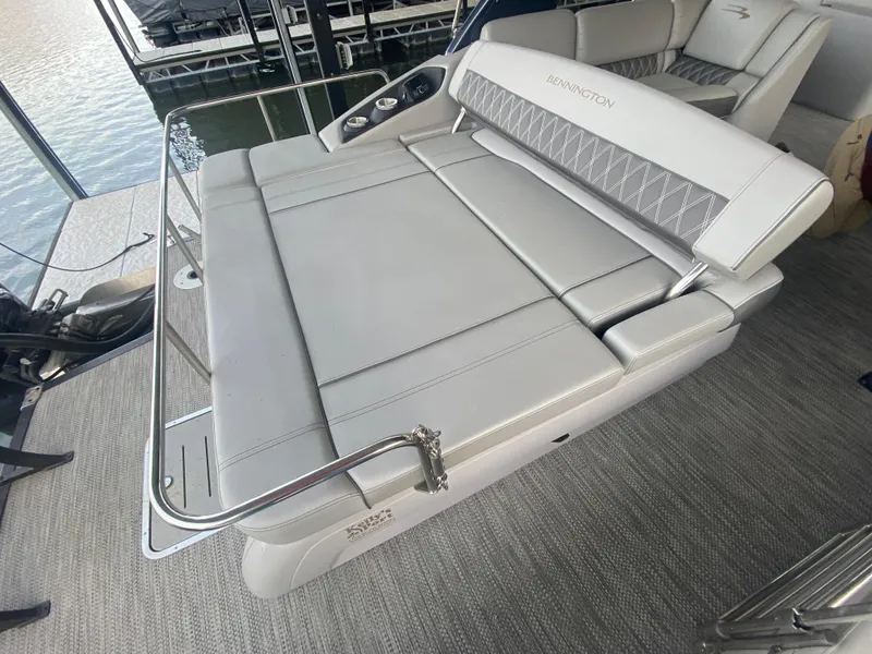 Slide: The Image of 2020 Bennington 30 QSBAX2 boat with spacious gray seating area. - 23