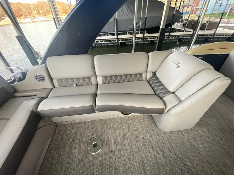 Slide: The Image of Luxurious seating on a 2020 Bennington 30 QSBAX2 boat, featuring elegant gray upholstery. - 28