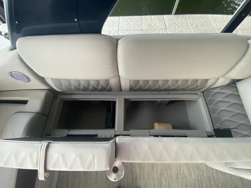Slide: The Image of 2020 Bennington 30 QSBAX2 boat interior with open storage compartments. - 29