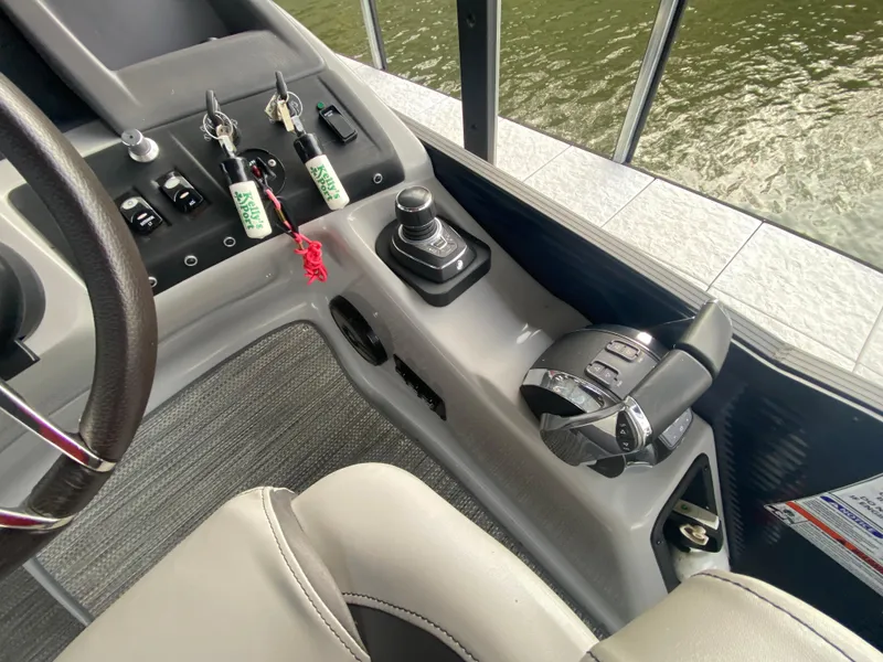Slide: The Image of Control panel of 2020 Bennington 30 QSBAX2 boat with steering and throttle. - 38