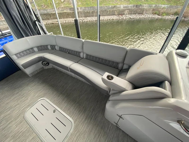 Slide: The Image of Luxurious seating on 2020 Bennington 30 QSBAX2 pontoon boat, overlooking serene water. - 45