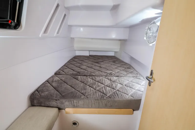Slide: The Image of 2025 Seawind 1260 cabin interior with a cozy bed and modern design. - 30