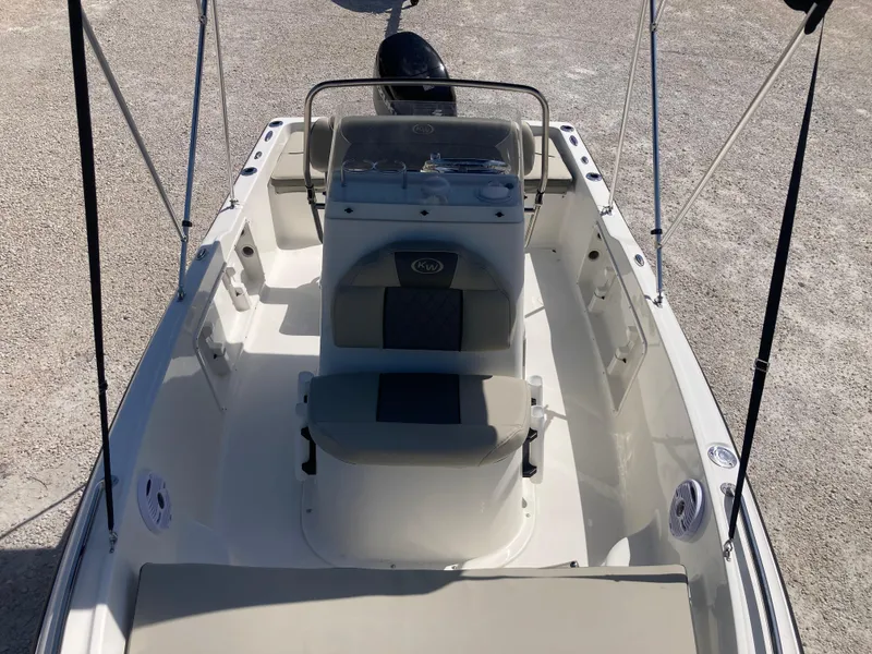 Slide: The Image of 2025 Key West 1720CC boat interior with console and seating, viewed from above. - 10