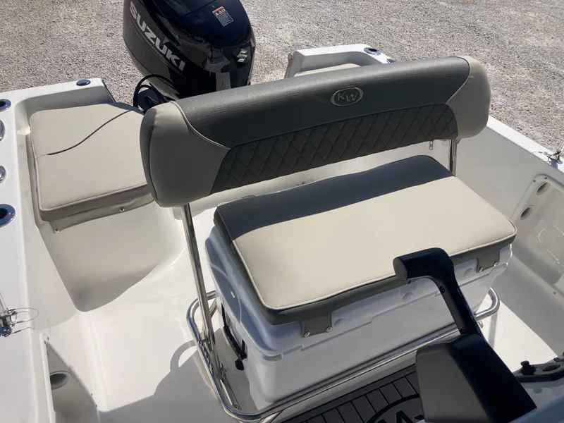 Slide: The Image of 2025 Key West 1720CC boat interior with cushioned seating and Suzuki outboard motor. - 11