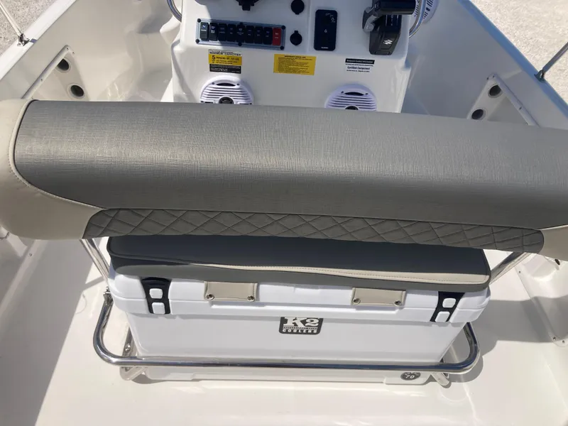 Slide: The Image of 2025 Key West 1720CC boat interior with cushioned seating and control panel. - 6