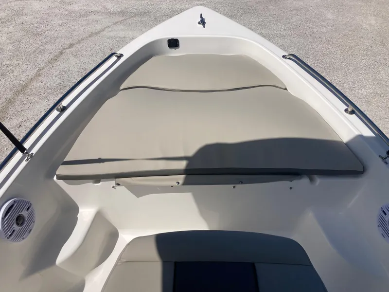 Slide: The Image of 2025 Key West 1720CC boat interior with cushioned seating and sleek design. - 8