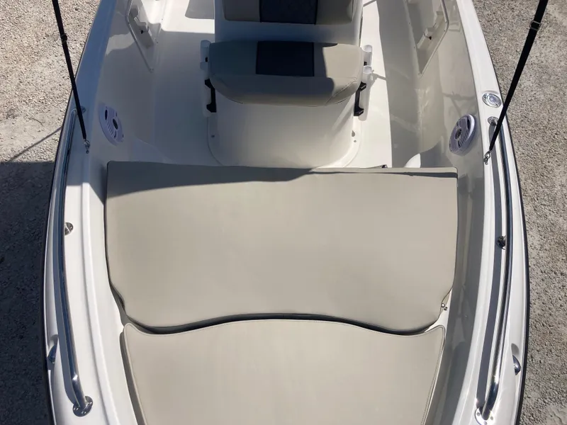 Slide: The Image of 2025 Key West 1720CC boat interior with cushioned seating and console. - 9