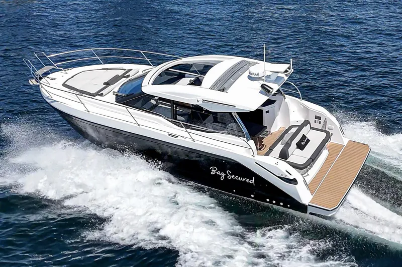 Slide: The Image of 2023 Bavaria SR36 yacht cruising on open water, showcasing sleek design and luxury features. - 18