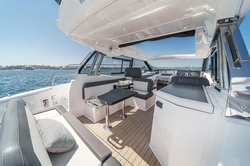 Slide: The Image of Luxurious 2023 Bavaria SR36 yacht interior with sleek seating and ocean view. - 26