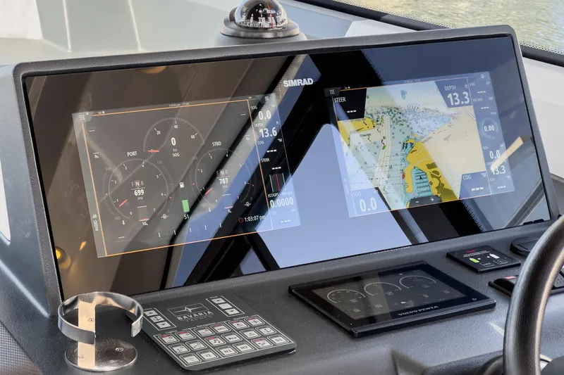 Slide: The Image of Dashboard of 2023 Bavaria SR36 boat with navigation and control displays. - 36