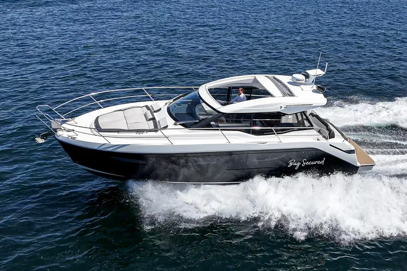 Slide: The Image of 2023 Bavaria SR36 yacht cruising on open water, showcasing sleek design and performance. - 0