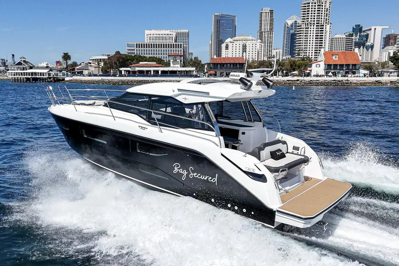 Slide: The Image of 2023 Bavaria SR36 yacht cruising in urban waterfront setting. - 15