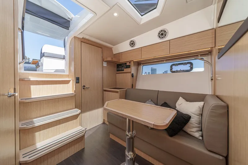 Slide: The Image of Interior of 2023 Bavaria SR36 yacht with modern seating and wooden accents. - 43
