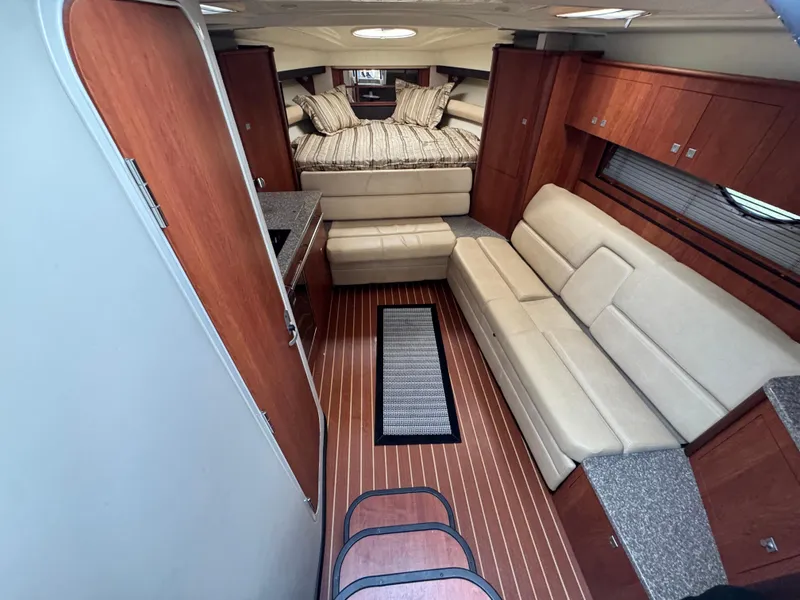 Slide: The Image of Interior of 2011 Monterey 320 Sport Yacht with cozy seating and elegant wood finishes. - 18