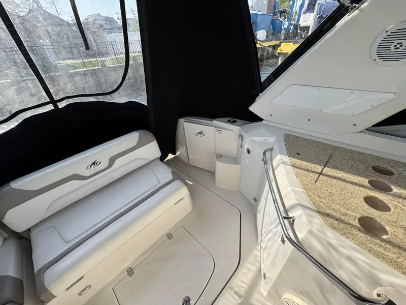 Slide: The Image of 2011 Monterey 320 Sport Yacht interior with seating and storage compartments. - 3