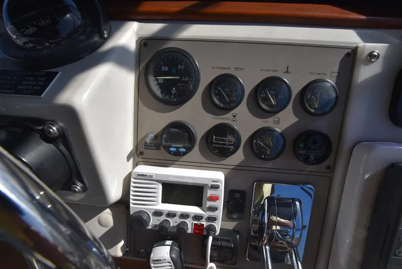 Slide: The Image of Control panel of a 1997 Carver 405 Aft Cabin Motoryacht with gauges and radio equipment. - 10