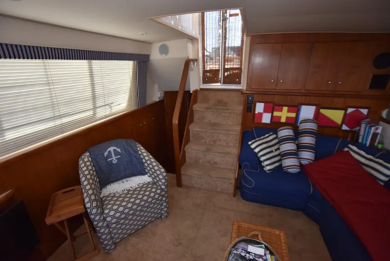 Slide: The Image of Interior of 1997 Carver 405 Aft Cabin Motoryacht with cozy seating and nautical decor. - 16