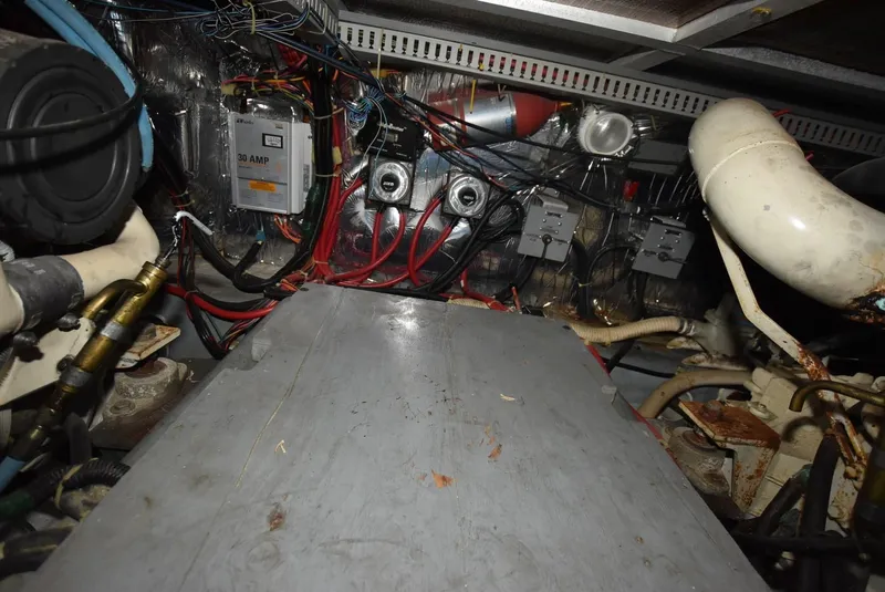 Slide: The Image of Engine room of 1997 Carver 405 Aft Cabin Motoryacht with wiring and machinery. - 38