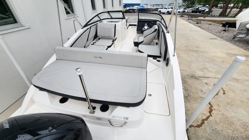 Slide: The Image of 2024 Sea Ray SPX 210 OB boat with sleek interior and modern design. - 12