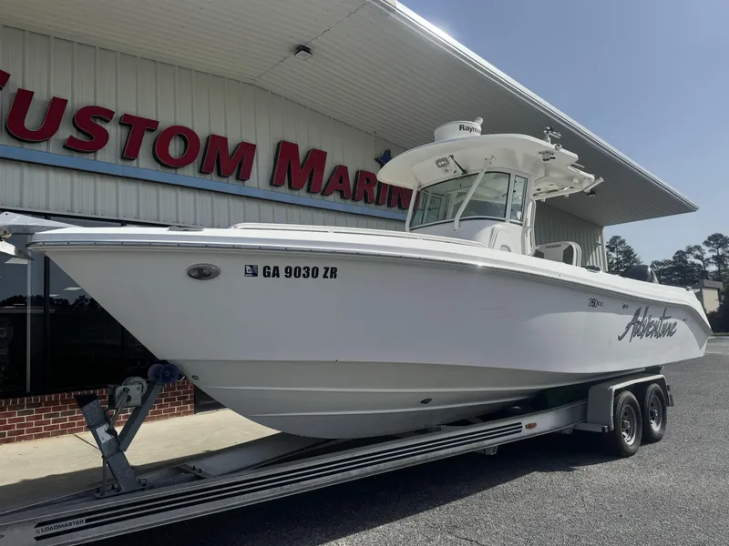 Slide: The Image of 2007 Everglades 260CC boat on trailer at Custom Marine dealership. - 3