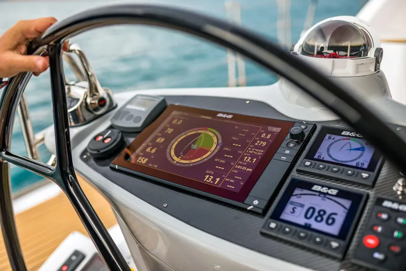 Slide: The Image of Steering console of 2025 Seawind 1600 Passagemaker with advanced navigation displays. - 32