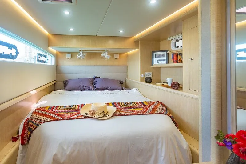 Slide: The Image of Luxurious cabin interior of 2025 Seawind 1600 Passagemaker with cozy bed and modern decor. - 40