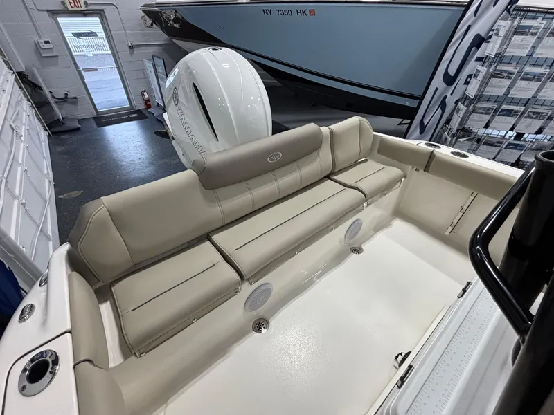 Slide: The Image of 2023 Key West 219 FS boat interior with beige seating and modern design. - 10