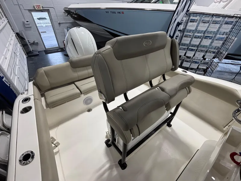 Slide: The Image of 2023 Key West 219 FS boat interior with beige seating and modern design. - 11